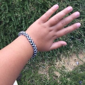 Black and white stretchy rubber band bracelet.